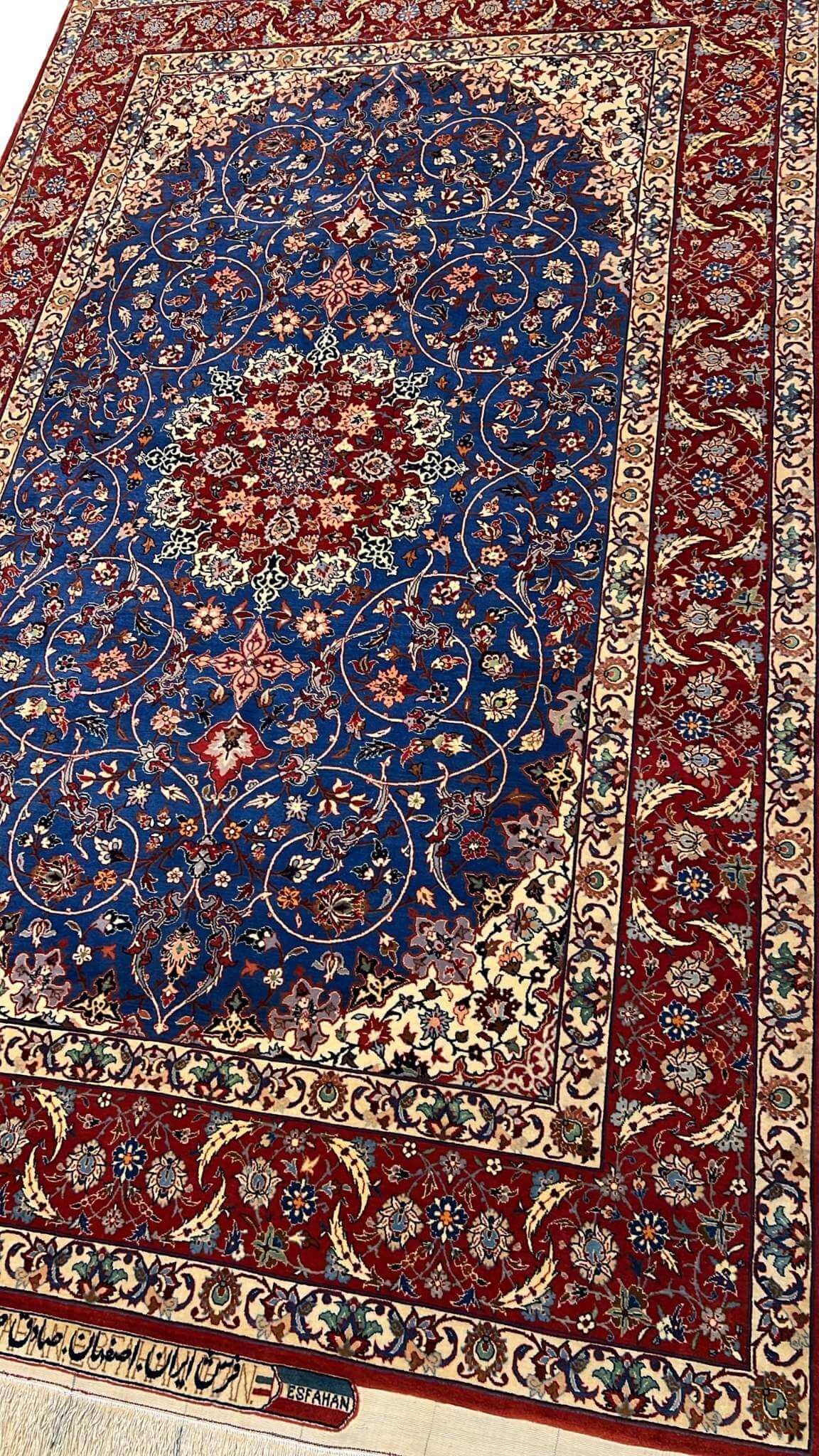 "50-year-old Seirafian Persian rug with natural dyes, crafted in Isfahan with traditional techniques."